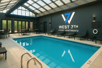 Glass enclosed pool and spa with retractable ceiling